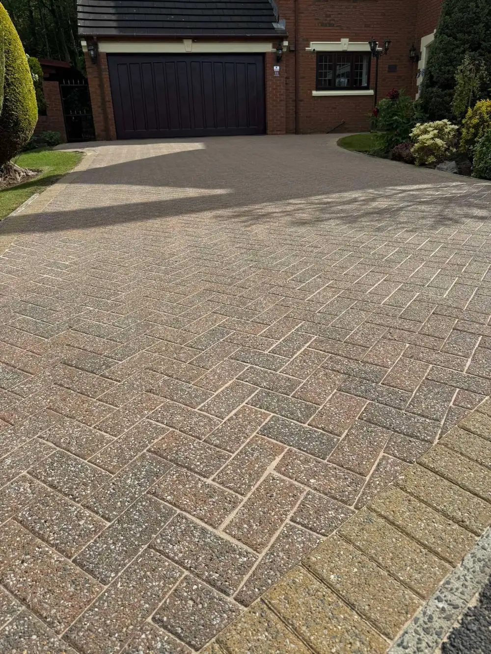The same buff block driveway after pressure washing