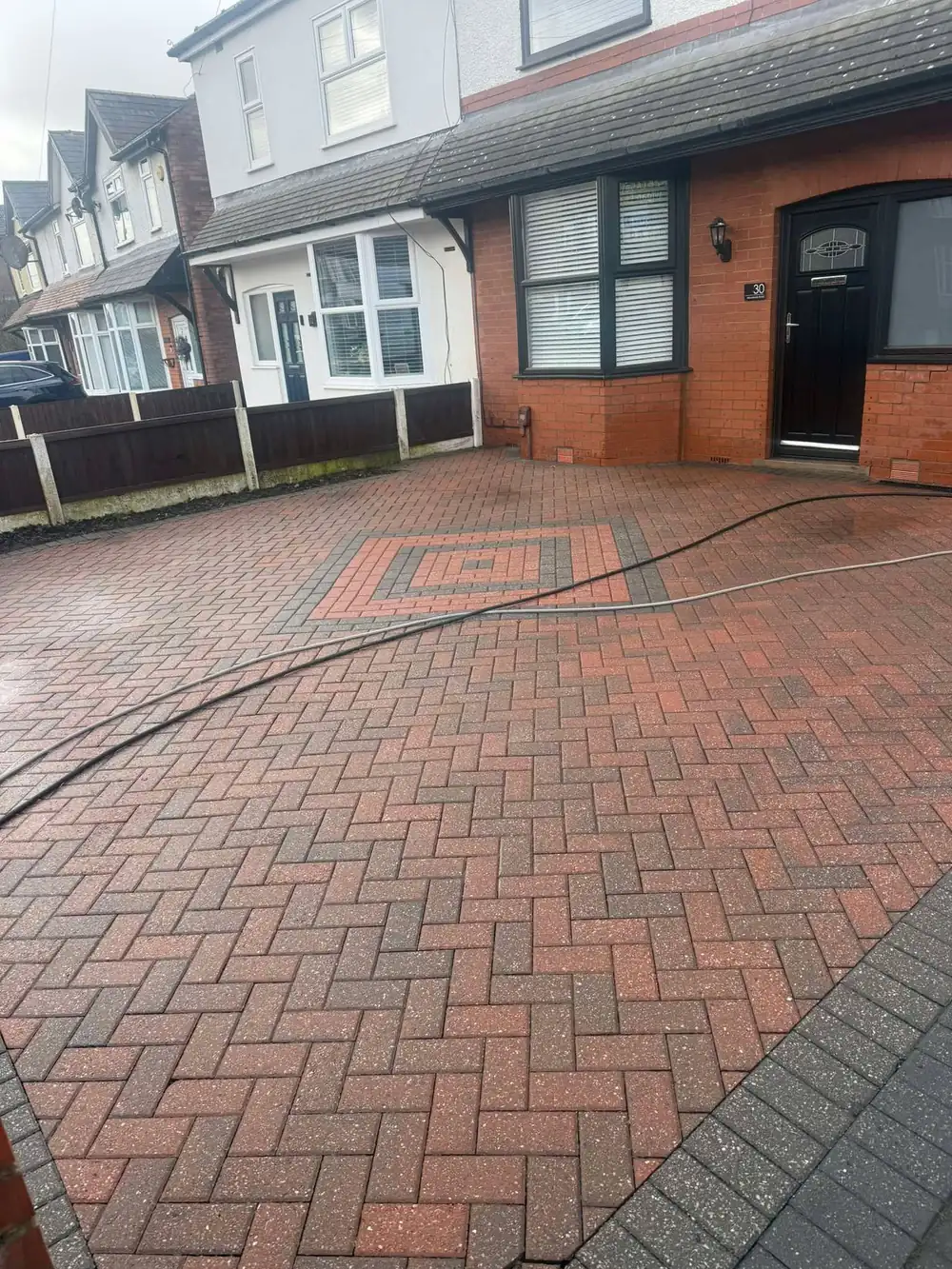 The same block driveway after cleaning