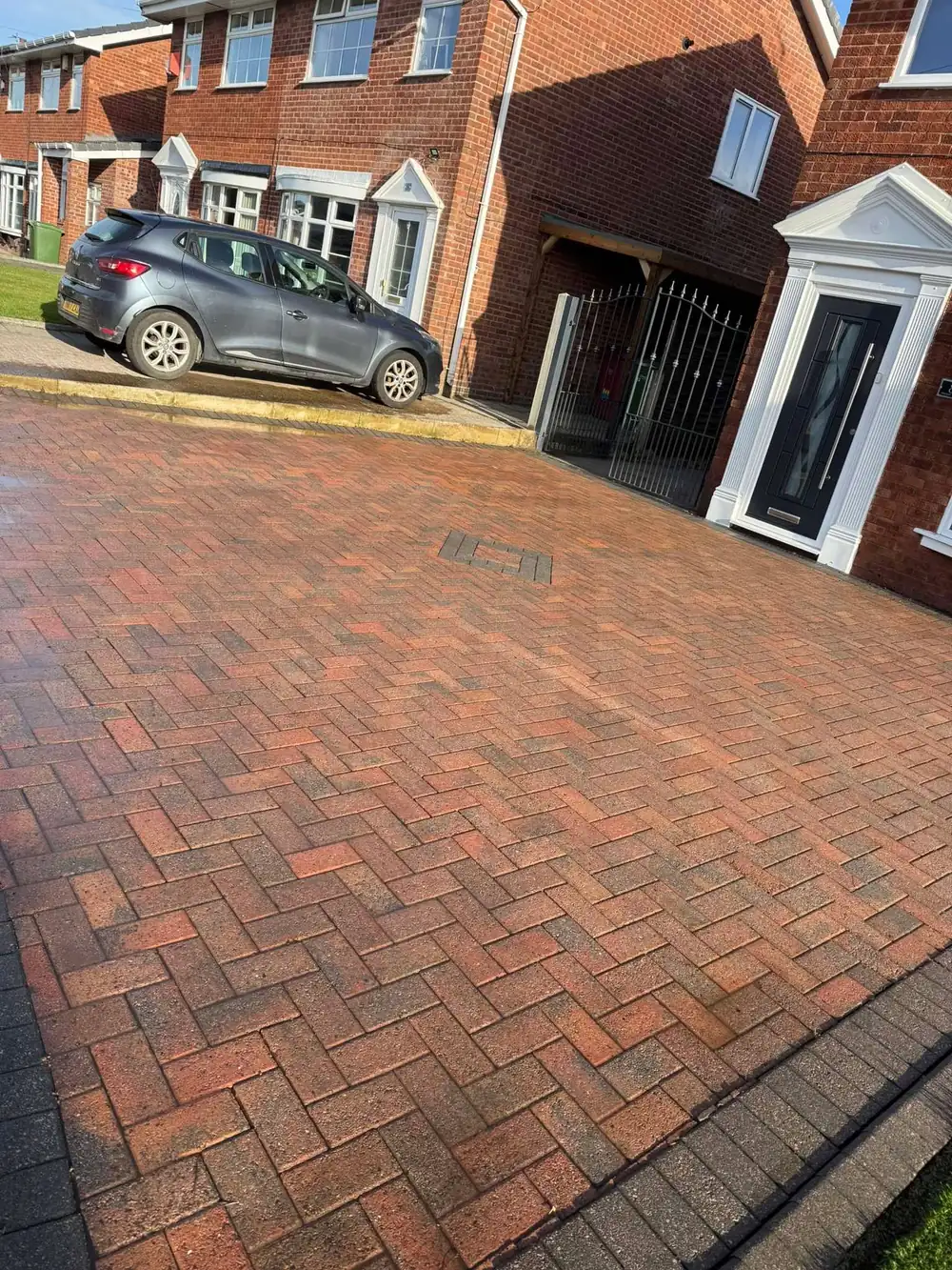 The same block paving driveway after pressure washing in Bolton