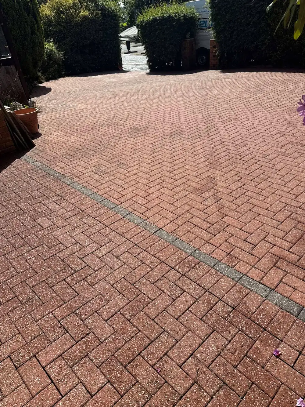 The same block paving driveway after cleaning, red colour back