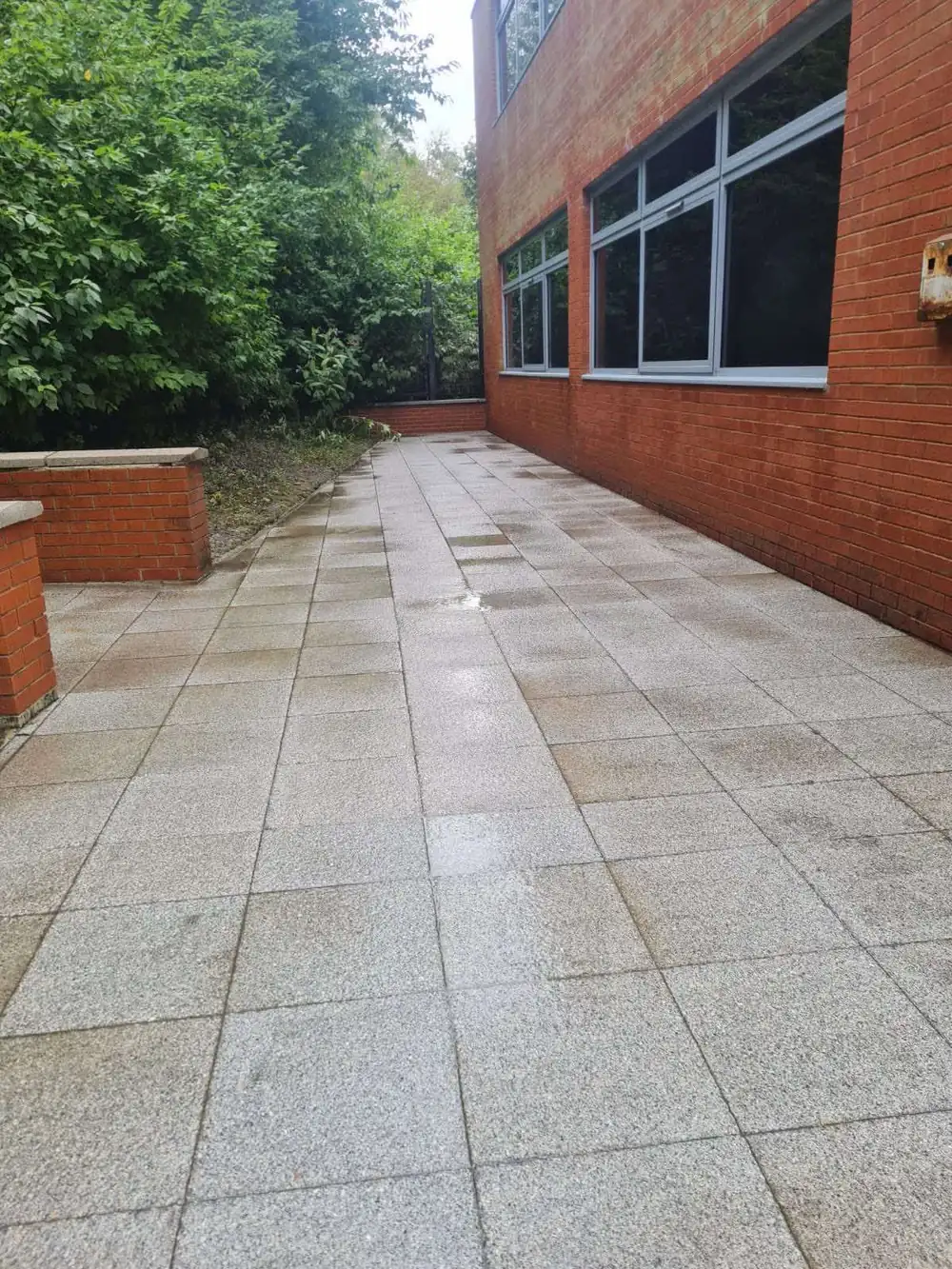 The same granite paving after commercial cleaning, clean grey finish