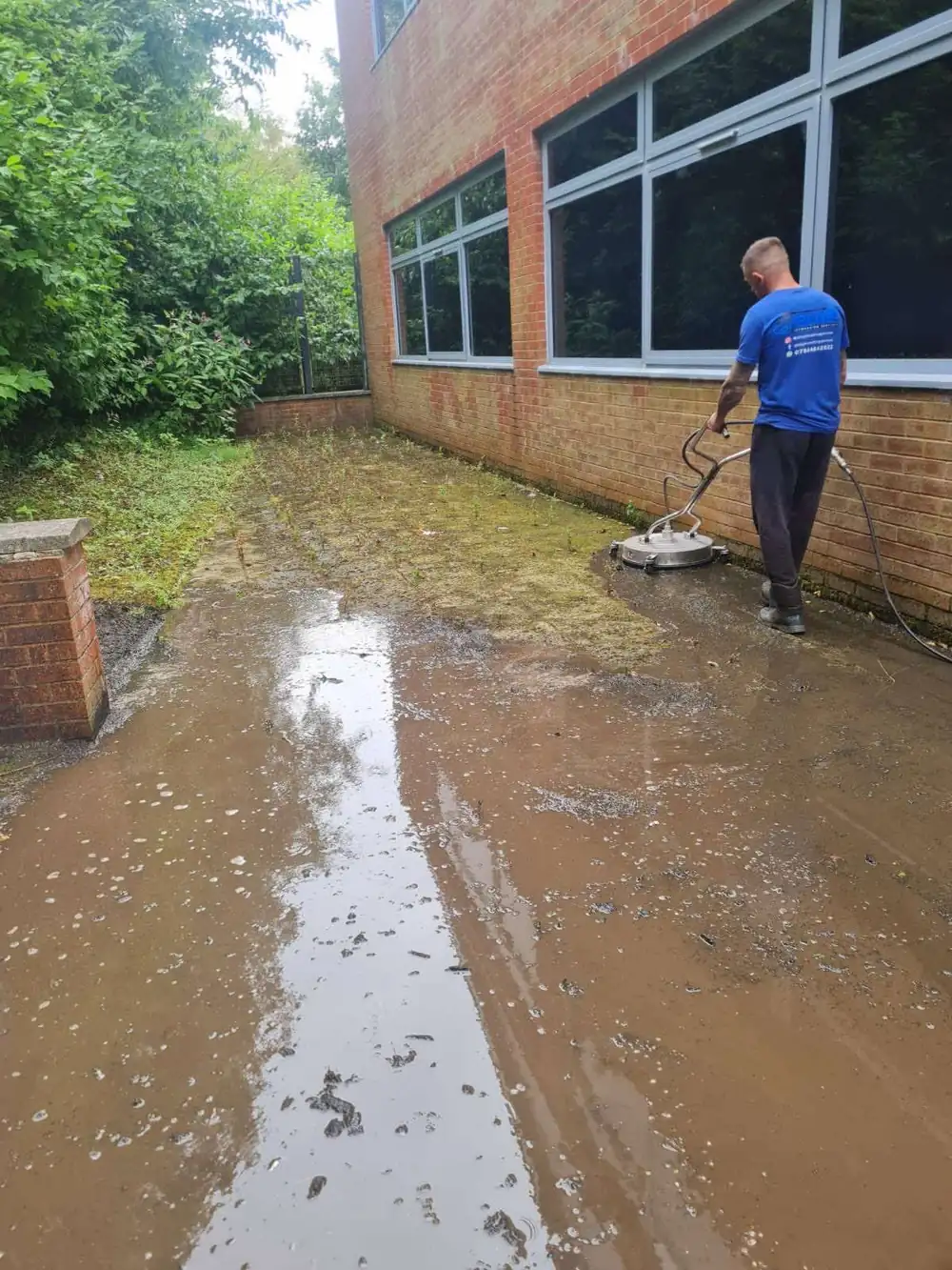 Dirty, green office granite paving before cleaning