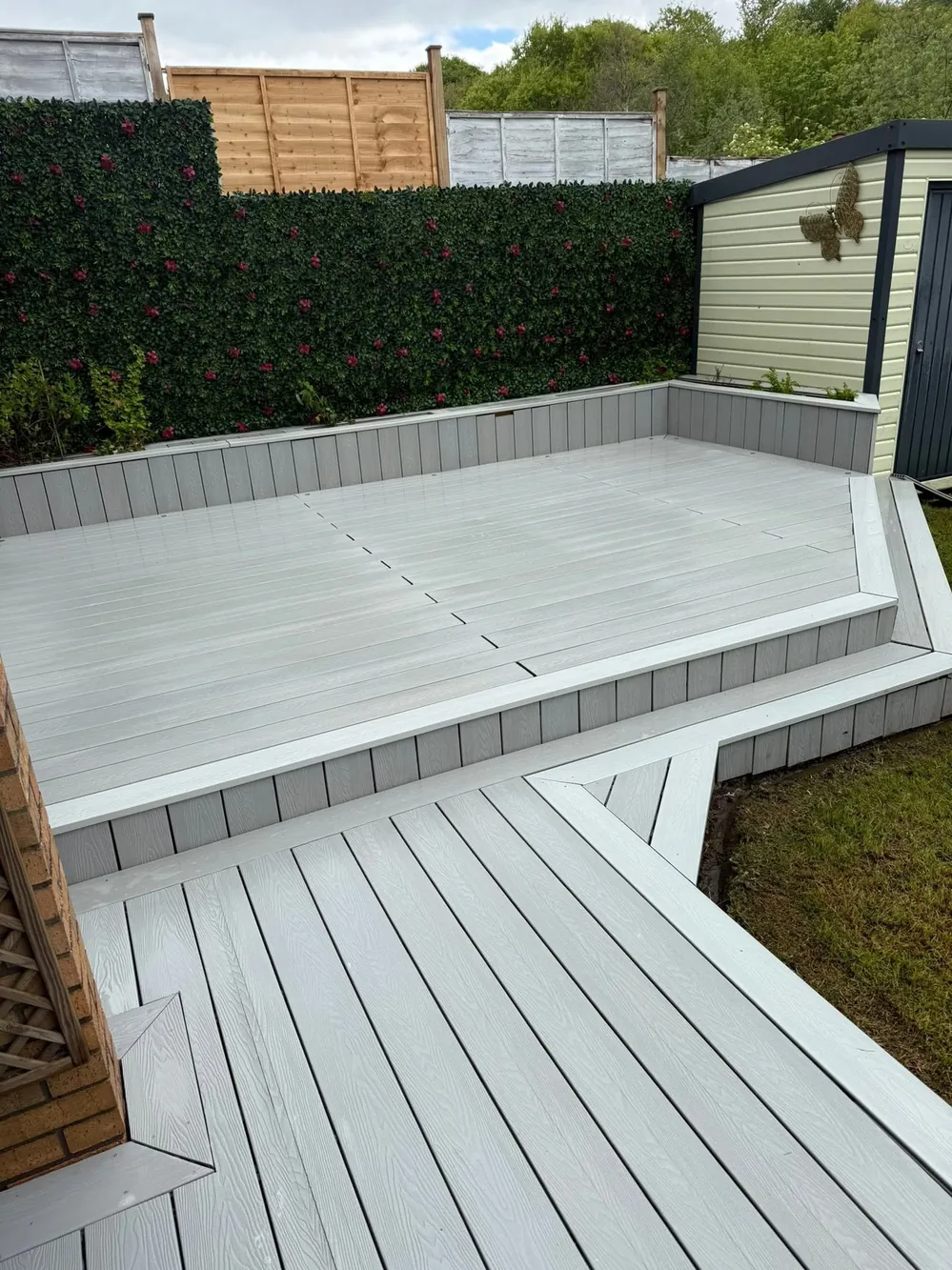 The same composite decking after a gentle clean, bright and even