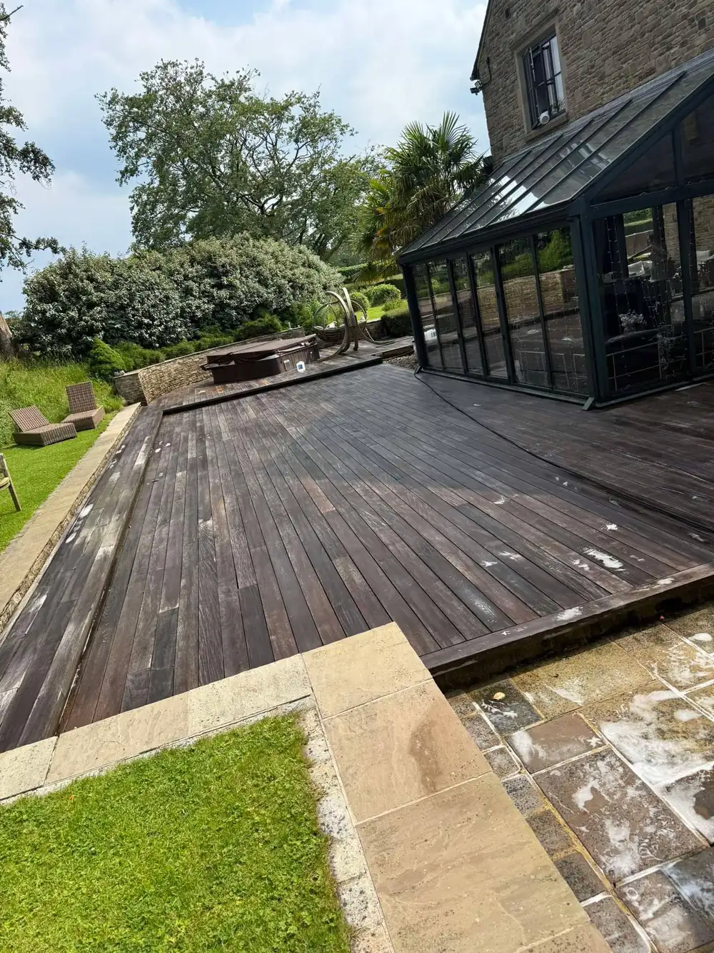 The same decking after cleaning, warm timber colour restored