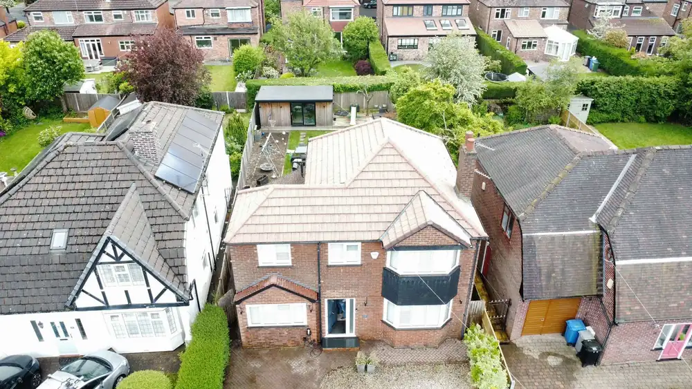 The same roof after cleaning, red tiles restored, drone photo