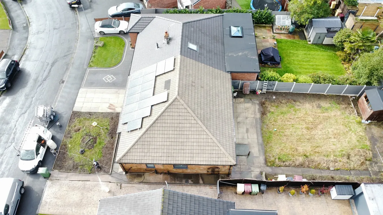 The same roof after cleaning and moss removal, tiles restored