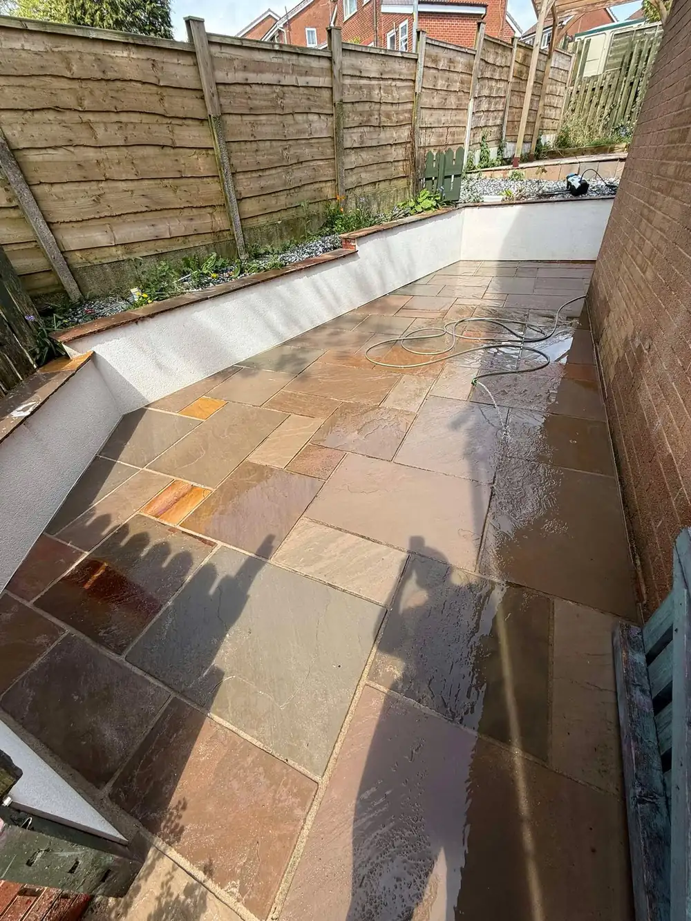 The same sandstone patio after a deep clean, warm colour revealed