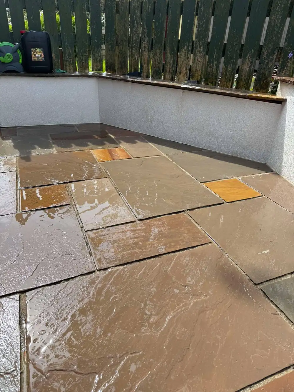 The same sandstone terrace after cleaning, golden stone back