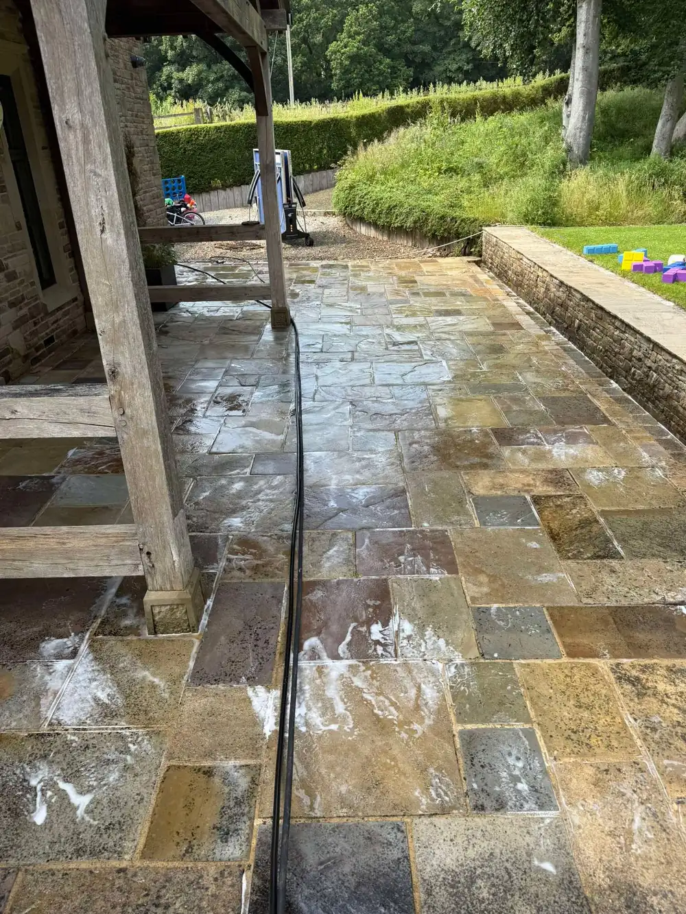 The same stone flags after cleaning, golden sandstone revealed